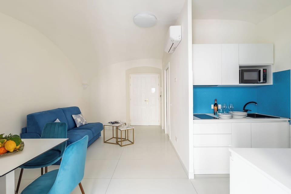 City Apartment | Living area | 32-inch flat-screen TV with digital channels