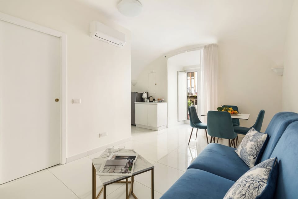 City Apartment | Living area | 32-inch flat-screen TV with digital channels