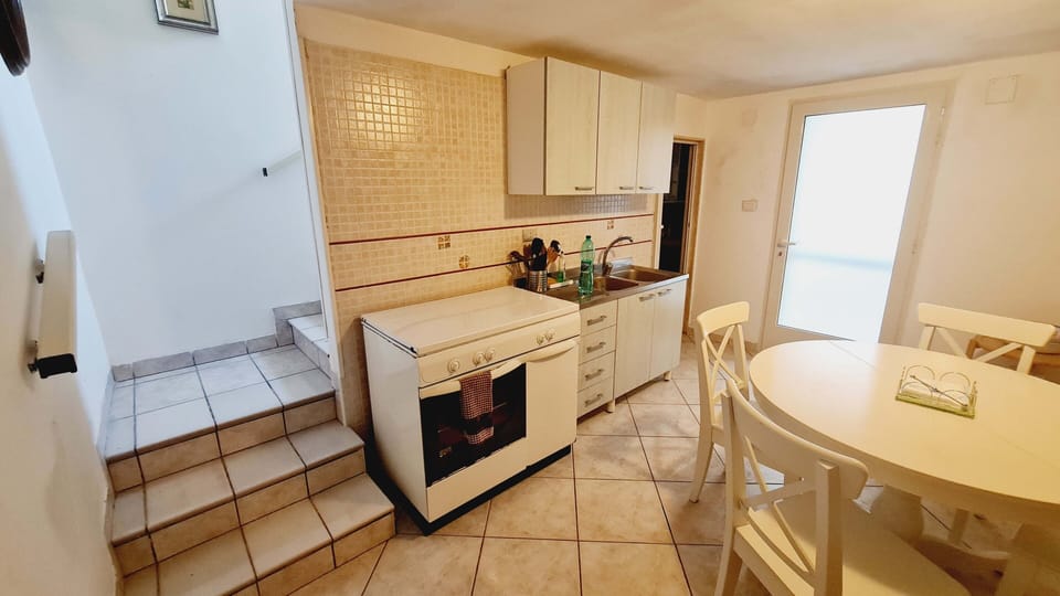 Apartment | Private kitchen | Full-size fridge, microwave, stovetop, cookware/dishes/utensils