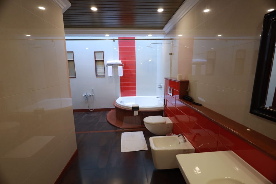 Honeymoon Cottage | Bathroom | Free toiletries, hair dryer, bathrobes, slippers