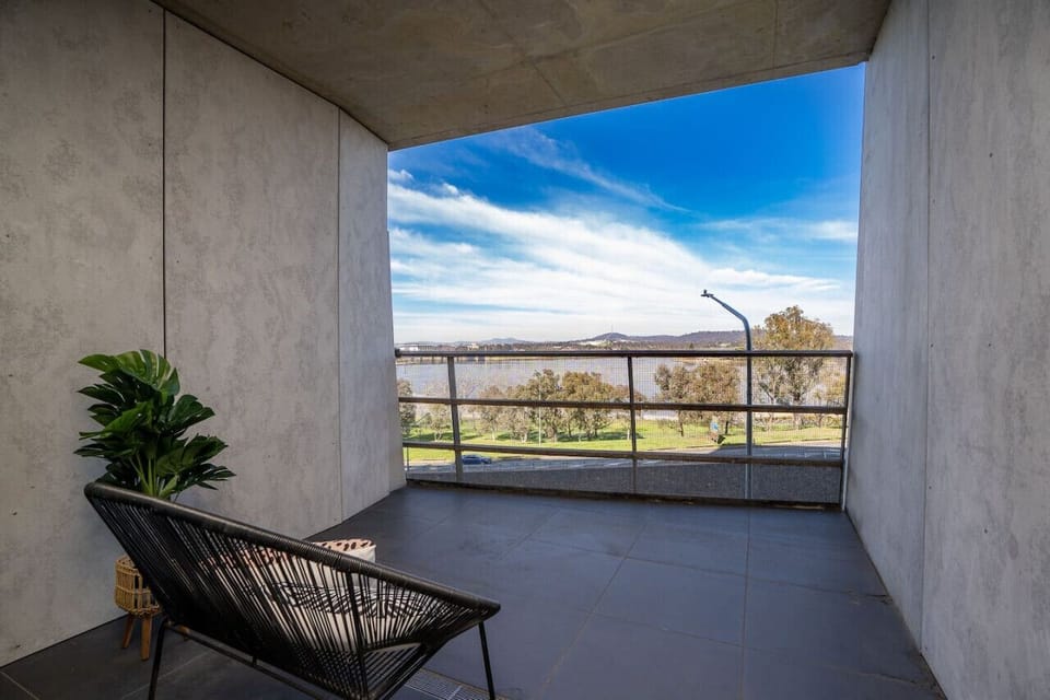 Step out onto the timber-decked balcony to breathe in the fresh air and take in the architecture.