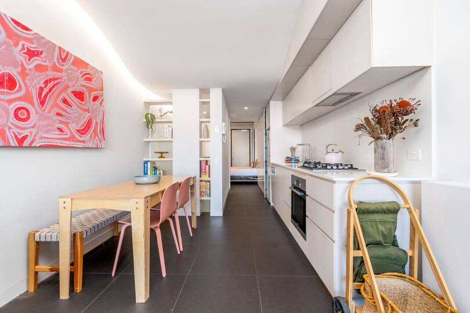 Create gourmet meals in the sleek, galley-style kitchen featuring high-end integrated appliances.