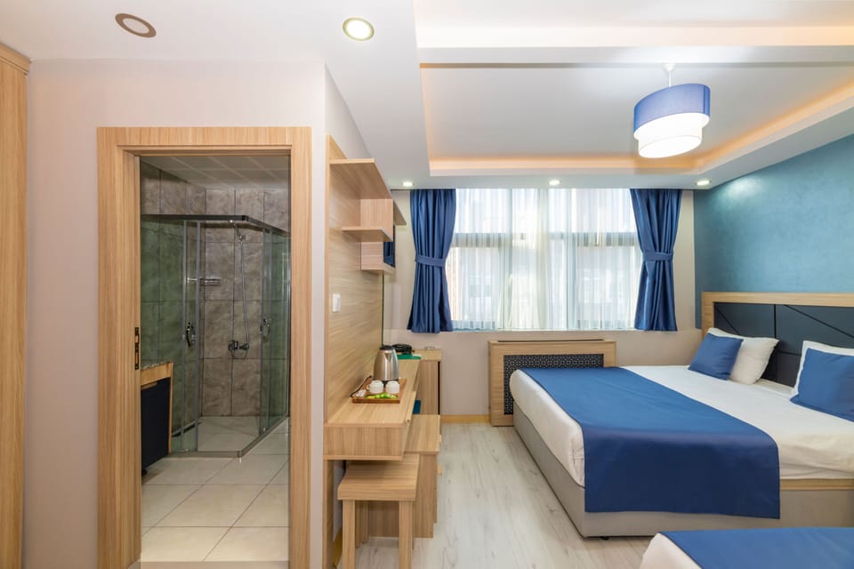 Family Room, 2 Bedrooms, Courtyard View | Egyptian cotton sheets, premium bedding, minibar, in-room safe