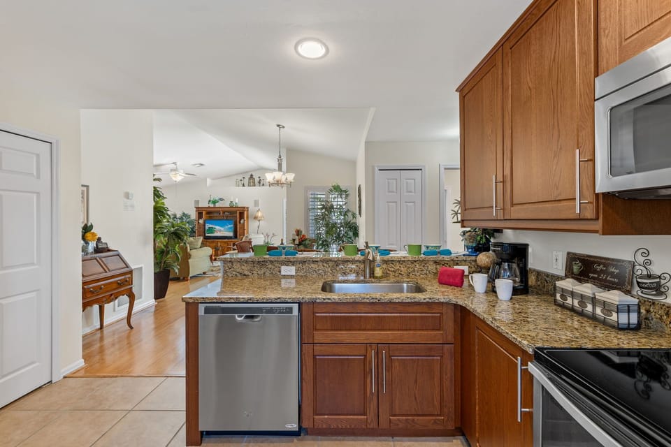 The kitchen has plenty of room and stainless steel appliances