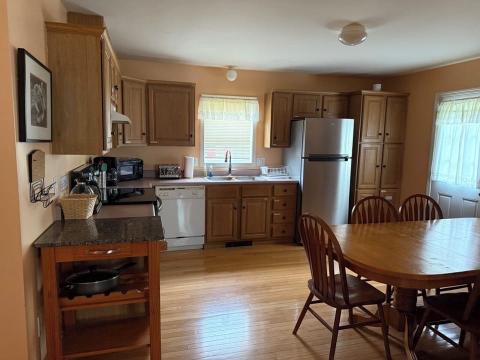Kitchen - Main Floor - refrigerator, dishwasher, dining table can fit up to 8.