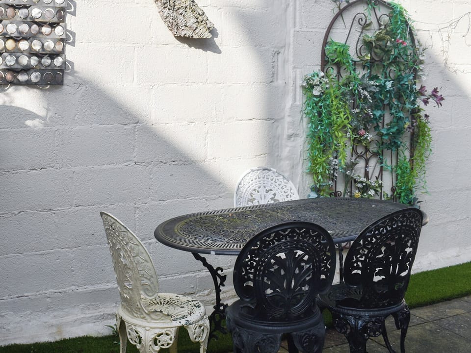 Rear garden with BBQ around the corner, side access to the front of the house | Avondale, Clacton on Sea
