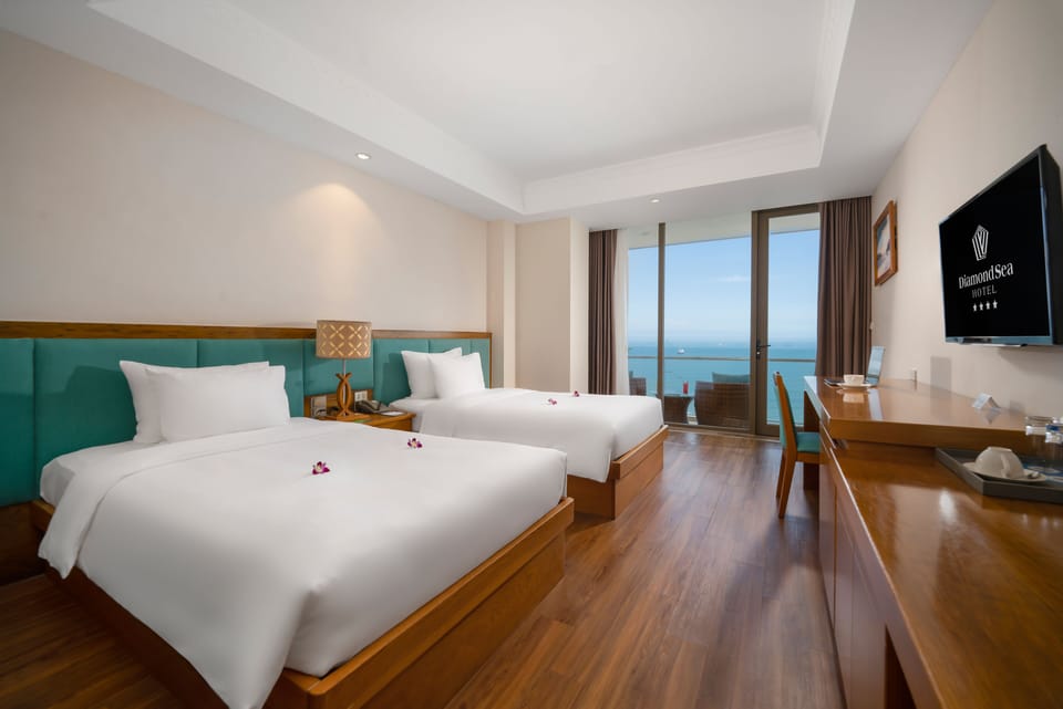 Premier Twin Room, Ocean View | Minibar, in-room safe, desk, laptop workspace