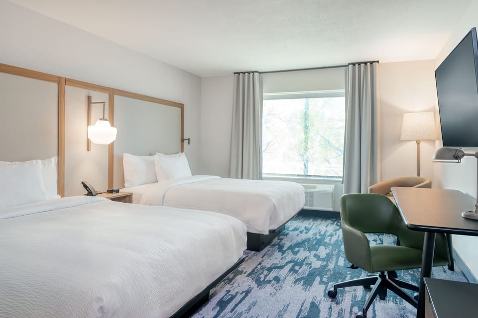 Premium bedding, pillowtop beds, desk, laptop workspace