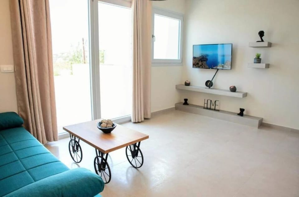 Luxury Apartment | Living area | 32-inch Smart TV with satellite channels