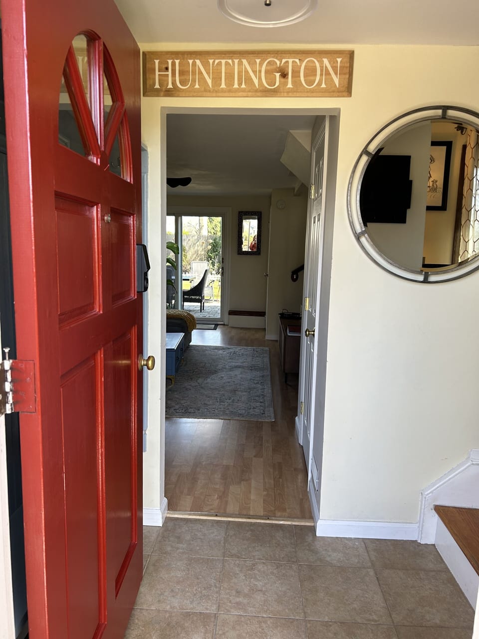 Mudroom with hooks for your coats leads to the den.