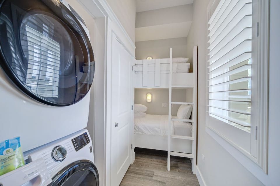  A handy in-unit laundry setup with modern appliances, tucked away for easy access.