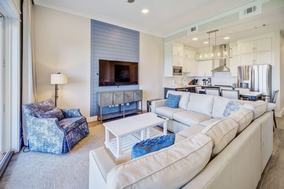 An open-concept living room with generous seating, designed for comfort and connection.