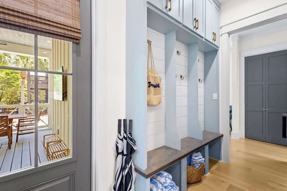 Custom built-in lockers by back door. Beach towels included!
