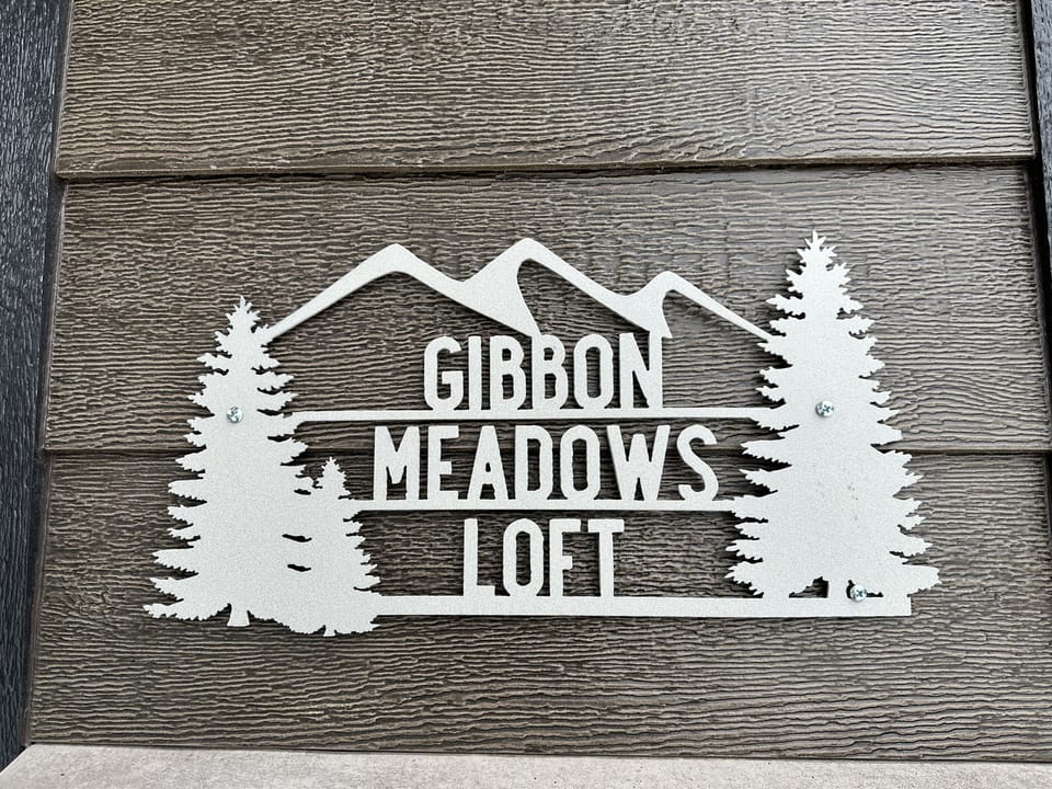 Look for the sign to the left of the garage doors—it marks the entrance to Gibbon Meadows Loft, ensuring you’ve arrived at the right place for your stay.