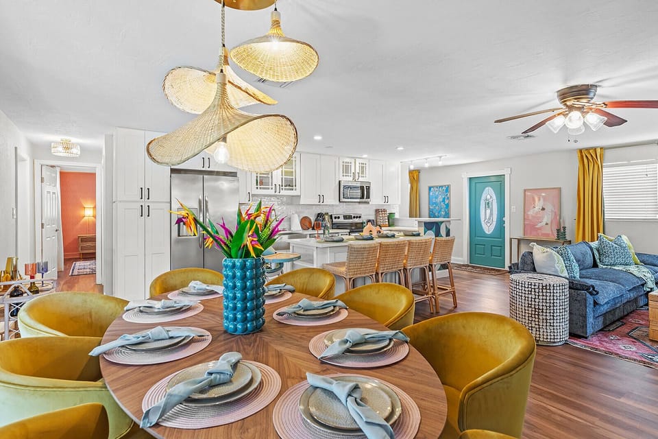 Open concept ft dining area with 8 seats, living room, and kitchen