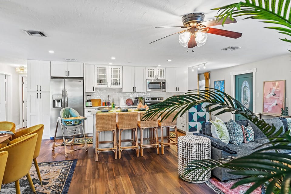 4 bar seats at the kitchen island; kitchen is steps away from the living room