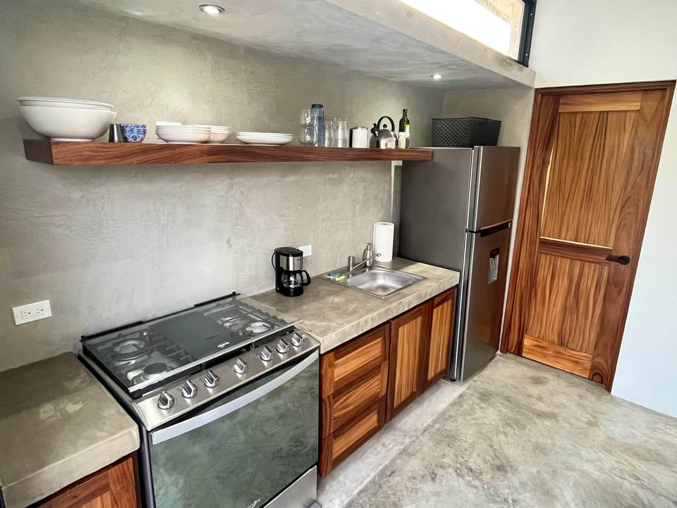 Both kitchenettes have stove, refrigerator, coffee maker and cooking necessities