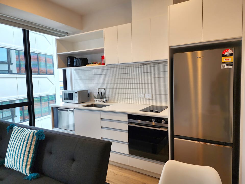 City Apartment | Living area | 50-inch LED TV with satellite channels
