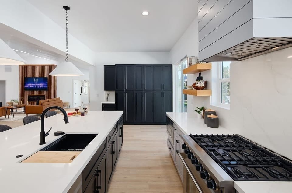 Fully Equipped Kitchen boasting brand-new stainless-steel appliances, ample cabinet / pantry storage and an oversized island offering ample counter space and bar seating.