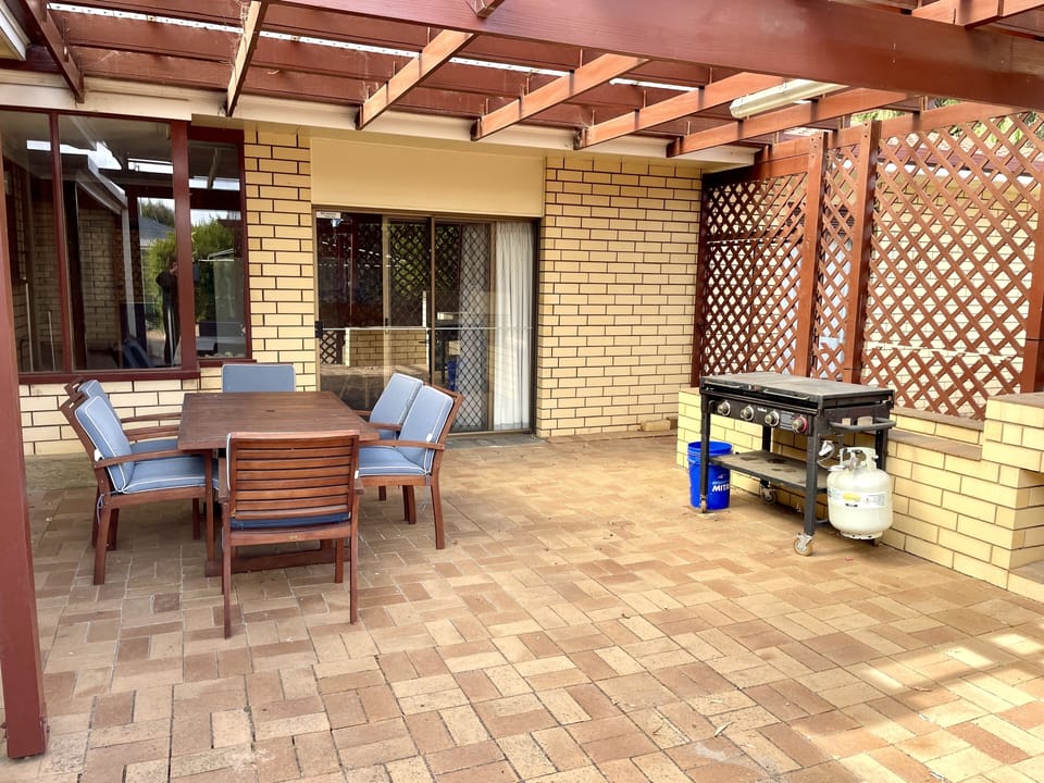 Outdoor dining area with gas BBQ