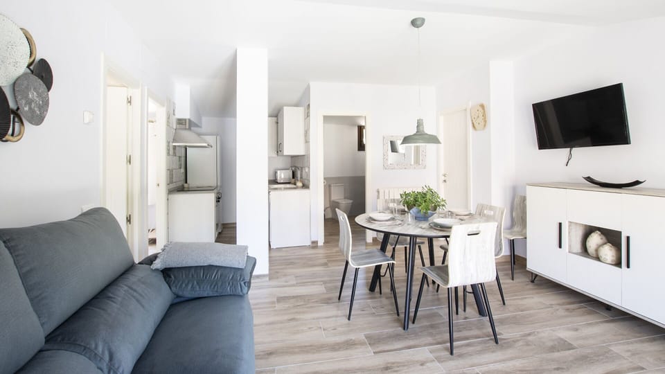 Deluxe Apartment, City View | Living area | TV
