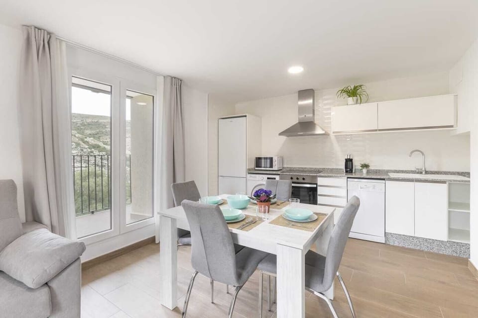 Panoramic Apartment, Balcony, Mountain View | Private kitchen | Full-size fridge, microwave, oven, stovetop
