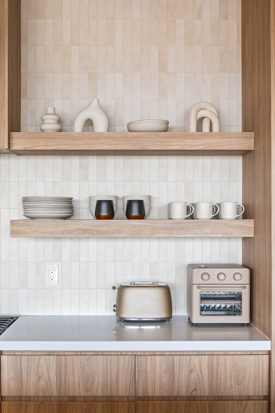 The essential kitchen amenities, including a SMEG toaster and Our Place air fryer.