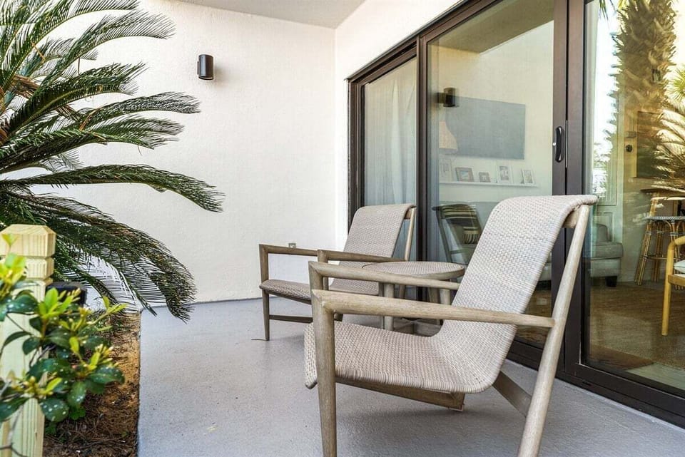The private patio provides two comfortable seats for relaxing outside, enjoying the weather, or having a quiet conversation.