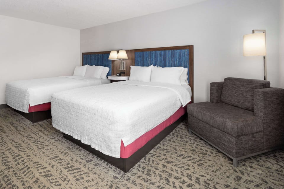 Two Queen Beds, Non-Smoking | Living area | 32-inch TV with cable channels