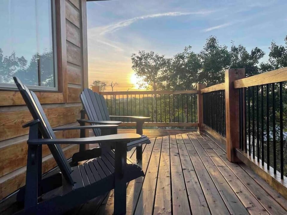 Relax on the 4 comfy adirondack chairs on the wrap-around deck 