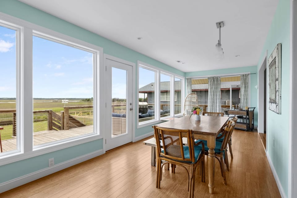 Dining area to enjoy a meal with family and friends while overlooking the marsh