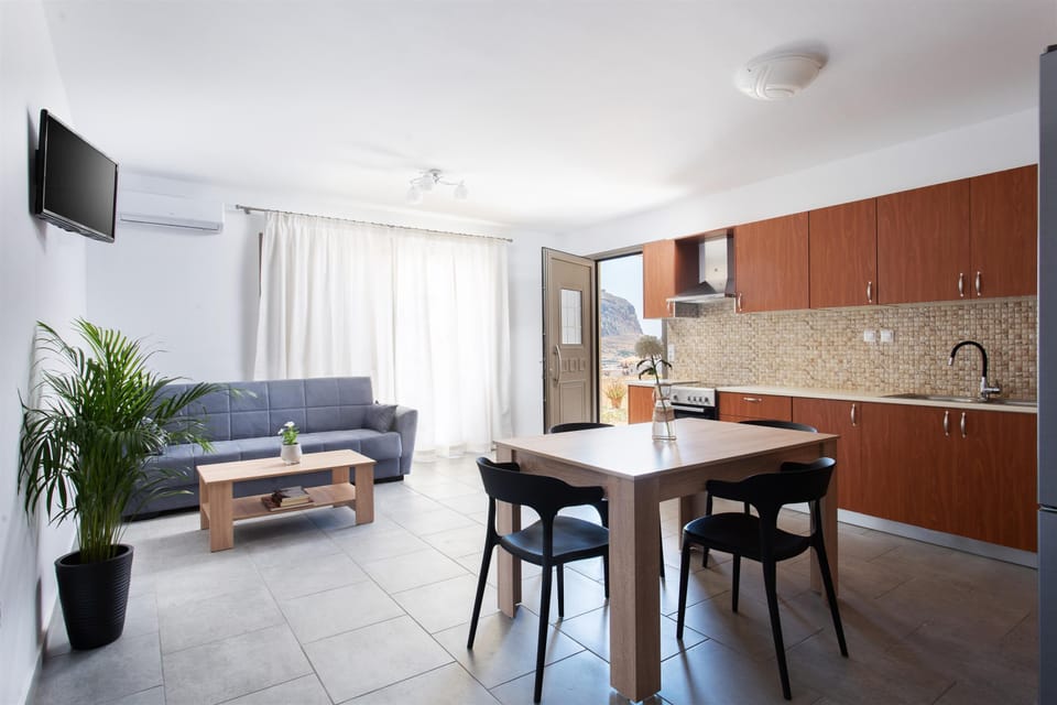 Family Suite, Sea View, Ground Floor | Living area | 28-inch LED TV with digital channels