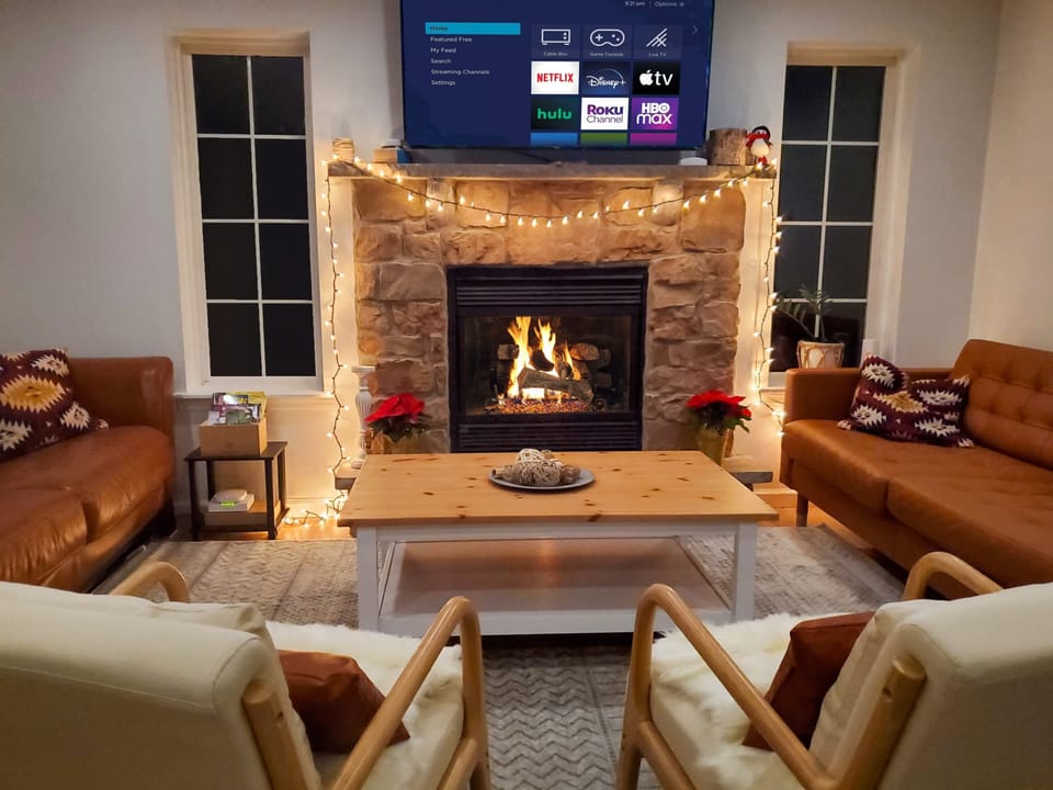 Immerse yourself in the cozy ambiance of our house, where the warmth of four fireplaces creates an unforgettable experience.