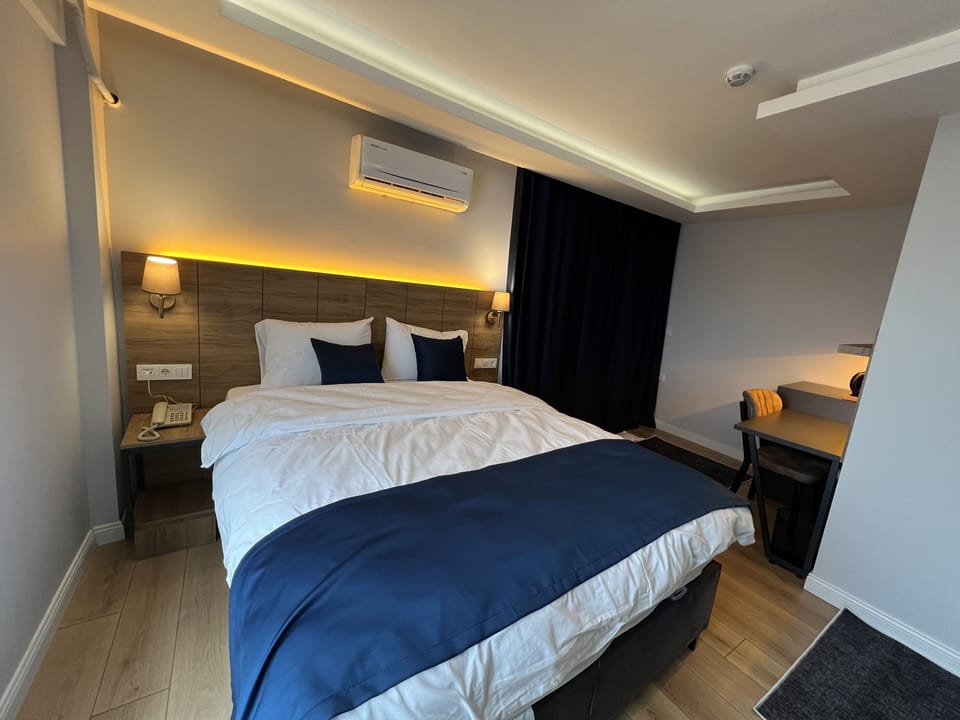 Deluxe Room, City View | 1 bedroom, premium bedding, down comforters, desk