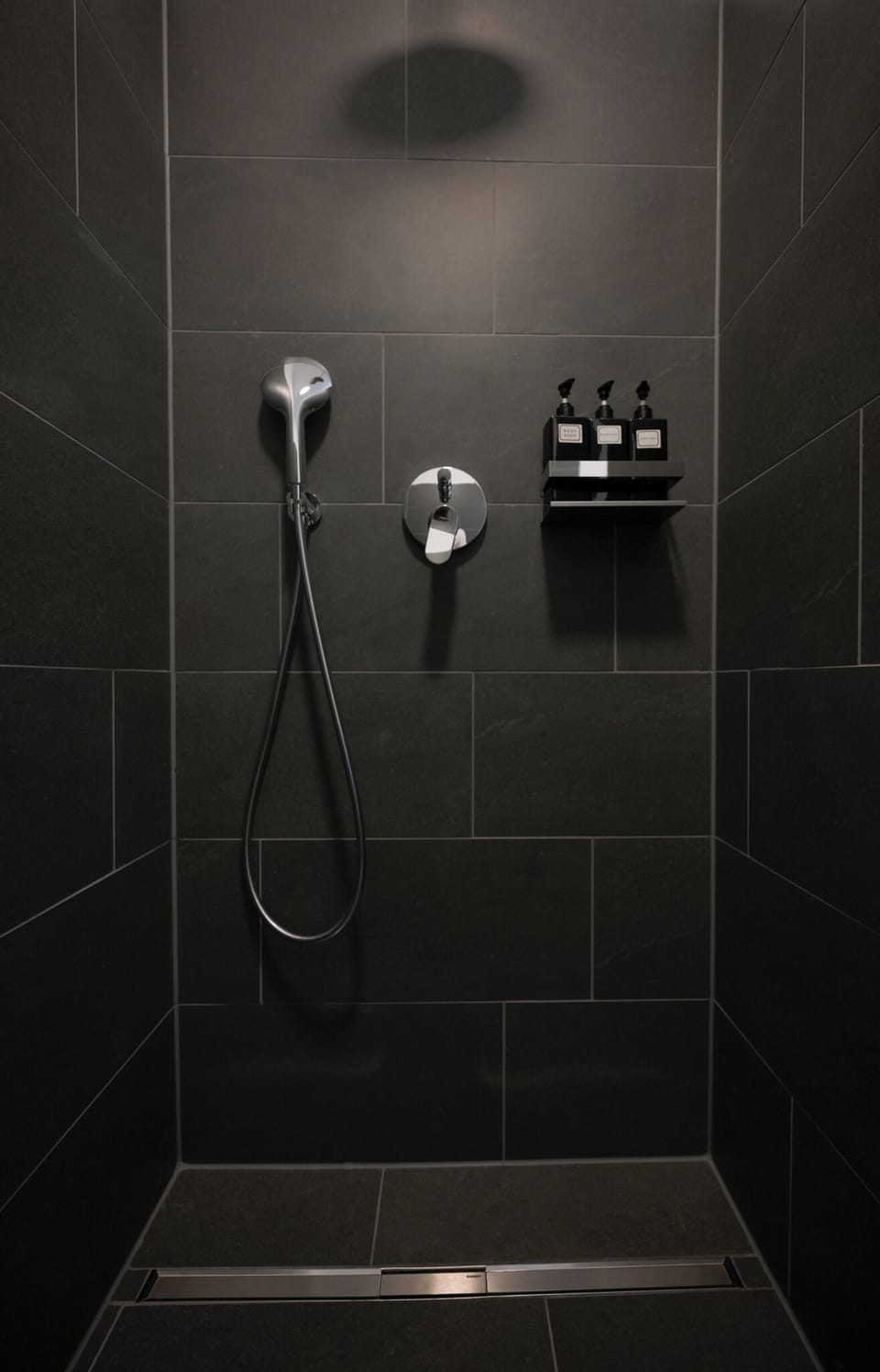 Shower, rainfall showerhead, hair dryer, towels