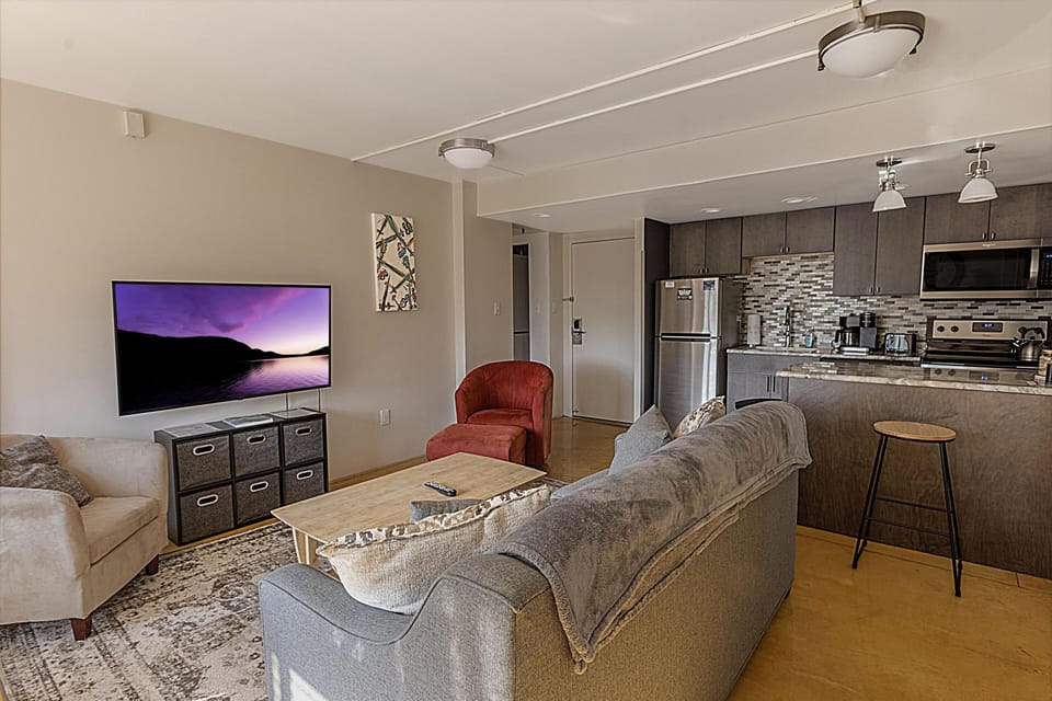Relax in the comfortable living room with the smart TV.