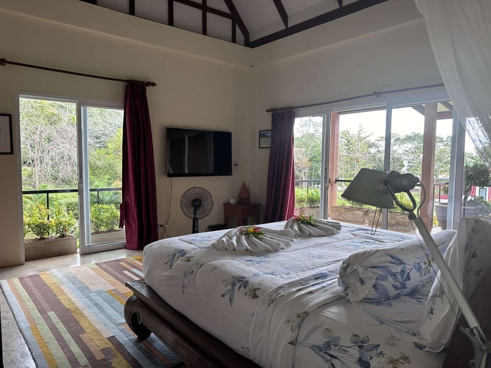 Piman Pu Lek bedroom with cathedral ceiling