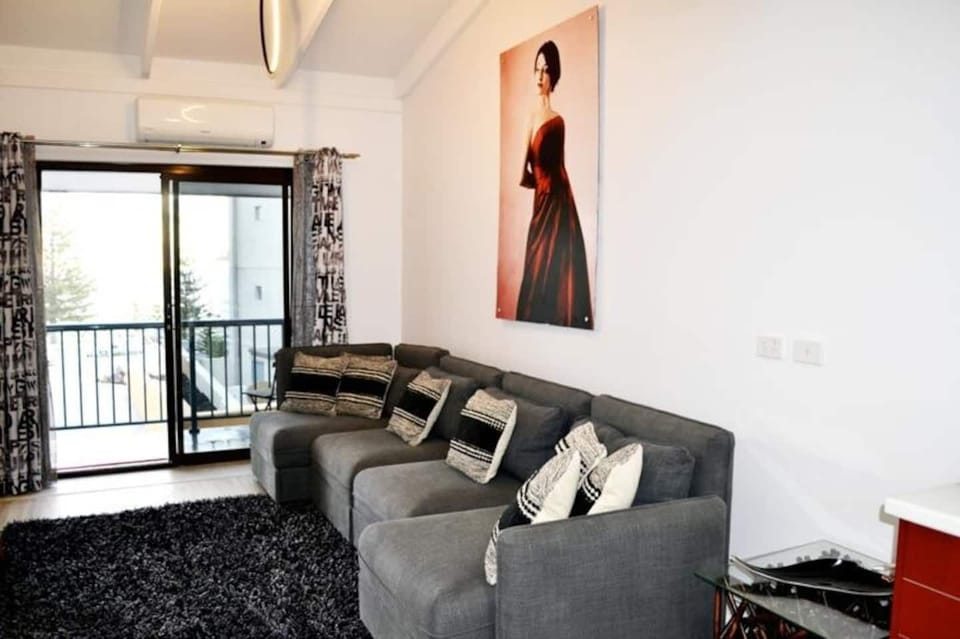Comfy couch to sit and watch some TV and also enjoy the ocean views from the apartment