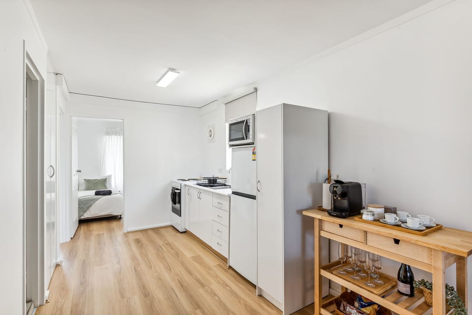 Kitchen fully set with Oven/Stove, full fridge & freezer, microwave, pots pans wine champagne and everything else needed for your stay.