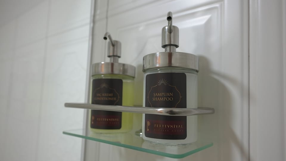 Shower, rainfall showerhead, designer toiletries, hair dryer