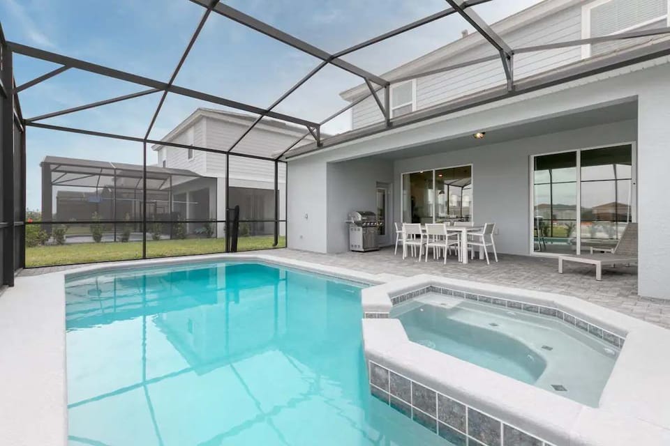 Chill in the private spa, take a swim, or grill poolside in screened comfort.