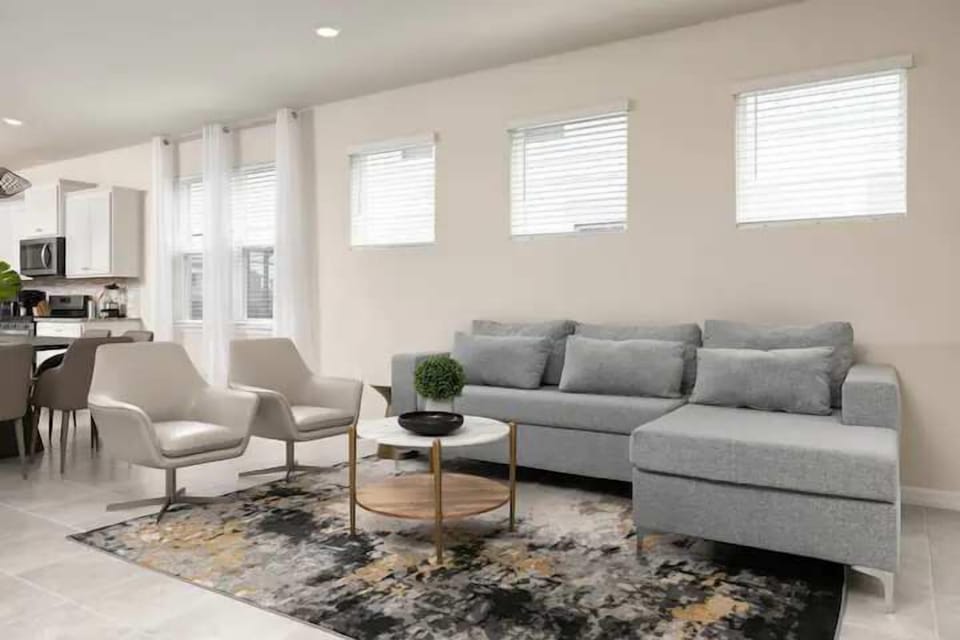 Bright, stylish living room with modern furniture and an open-concept layout.