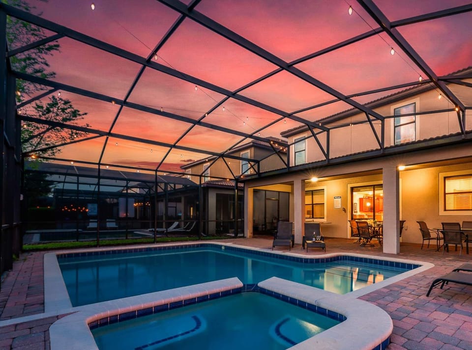 Evening-lit pool area creating a cozy vibe for nighttime swims.