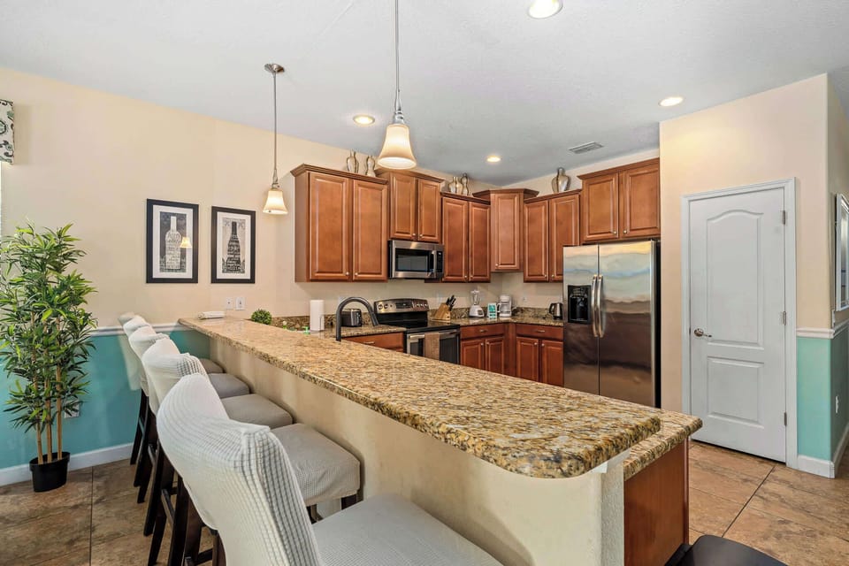 Open kitchen & dining layout designed for casual gatherings.