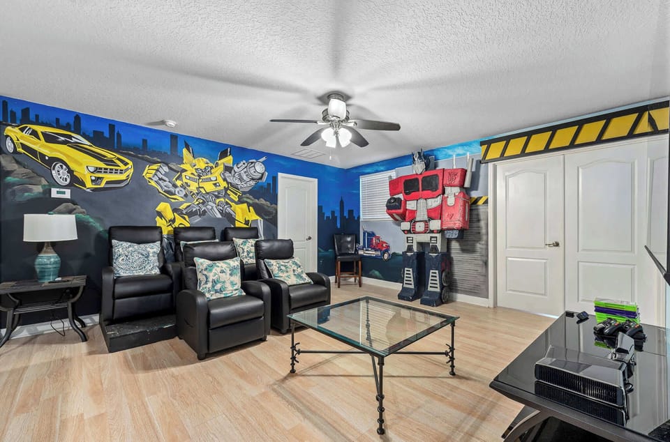 Game room w/ arcade games and seating, made for fun-filled hangouts.