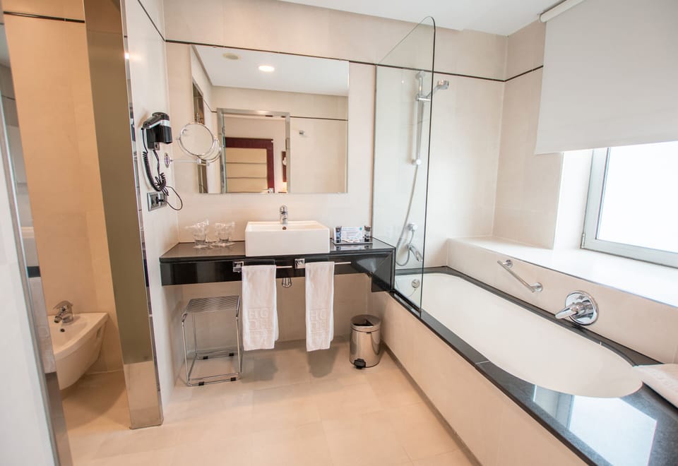 Bathtub, free toiletries, hair dryer, towels