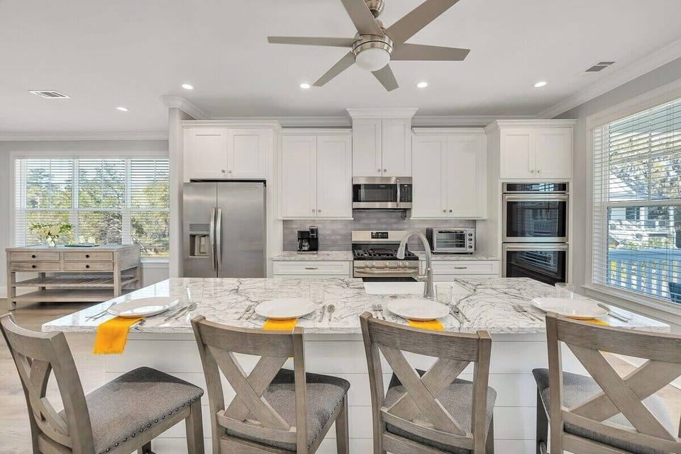 Modern kitchen with stainless steel appliances and island seating