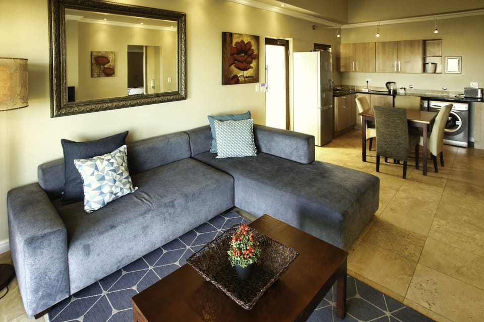 Comfort Apartment | Living area | 42-inch flat-screen TV with satellite channels
