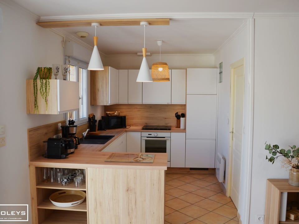 Kitchen with dishwasher, fridge, oven...
