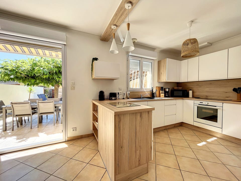 New, fully-equipped kitchen opening onto the living room and garden